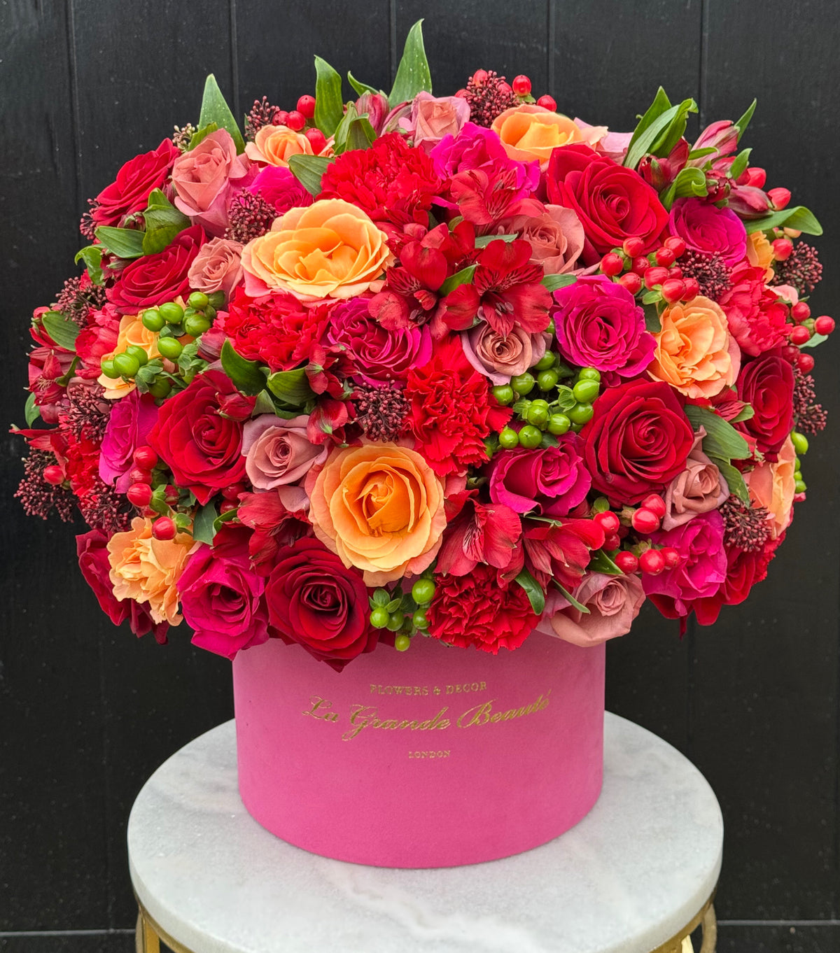 “Celebration” – roses, carnations and hypericum berries box by La Grande Beauté, luxury flower delivery London
