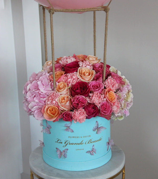 ''Pink Dreams Balloon'', , La Grande Beaute, Fresh, Escape the ordinary with the flower box "Pink Dreams Balloon"! Filled with different shades of pink roses, carnations and hydrangeas this box will take up, up and away! The arrangement in the photo is in the blue 25cm size La Grande Beaute velvet box that is designed and crafted to look like a hot air balloon. Central London Delivery Only. Please check our shipping policies for postcodes. DISCLAIMER - FRESH FLOWERS: These are fresh cut flowers 
