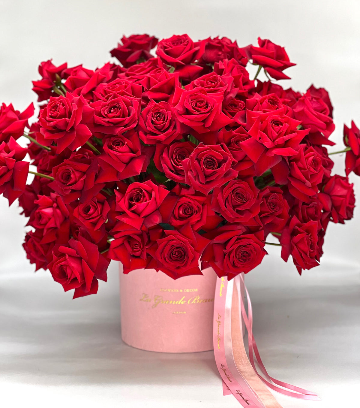 “Roses are Red” – red reflexed roses in a pink velvet box by La Grande Beauté, luxury flower delivery London