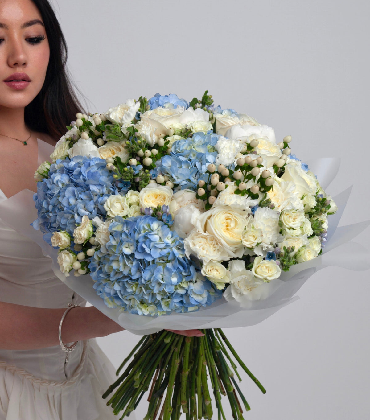 “Blue Light” – white and pale blue hand-tied bouquet by La Grande Beauté, luxury flower delivery London