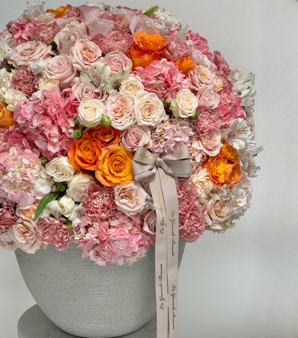 “Lady Lux” – large vase of orange, peach and pink flowers by La Grande Beauté, luxury flower delivery London