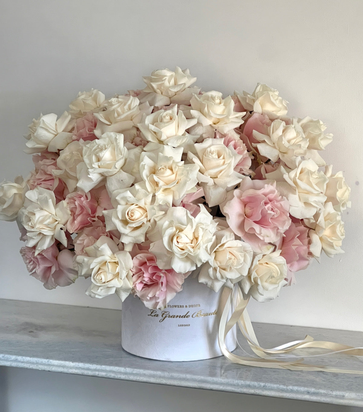 “Vanilla” – 50 reflexed blush and white roses in a box by La Grande Beauté, luxury flower delivery London