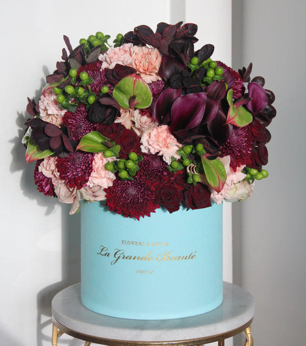 ''Eden'', freshflowerbox, La Grande Beaute, Fresh, Fresh flower box "Eden" was designed of an image of a magical enchanted garden. It is hand-crafted from roses, carnations, dahlias, calla lilies, hypericum berries and anthuriums in the velvet La Grande Beaute box. The arrangement in the photo is in the blue 25cm size La Grande Beaute velvet box. Central London Delivery Only. Please check our shipping policies for postcodes. DISCLAIMER - FRESH FLOWERS: These are fresh cut flowers and are perisha