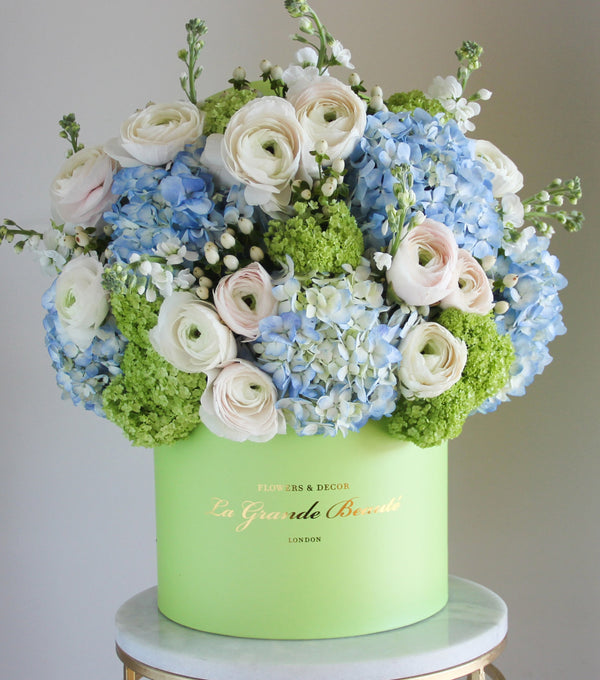 ''Spring Meadow'', freshflowerbox, La Grande Beaute, Fresh, mother, Bring spring to your home with box ''Spring Meadow''! Hydrangeas, ranunculus, matthiolas, and viburnums are used in this beauty to create a breathtaking flower box. The arrangement in the photo is in the green 27cm size La Grande Beaute box. Central London Delivery Only. Please check our shipping policies for postcodes. DISCLAIMER - FRESH FLOWERS: These are fresh cut flowers and are perishable.Please check "Care & Handling" for 