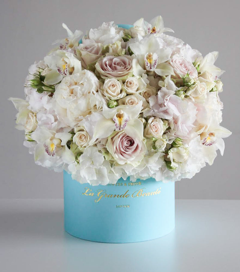 ''Glamour'', freshflowerbox, La Grande Beaute, Fresh, Romance is the glamour which turns the dust of everyday life into a golden haze. Filled with white peonies, hydrangeas, classic and spray roses and orchids this arrangement simply takes the breath away. The arrangement in the photo is in the blue 25cm size La Grande Beaute velvet box. Central London Delivery Only. Please check our shipping policies for postcodes. DISCLAIMER - FRESH FLOWERS: These are fresh cut flowers and are perishable.Pleas