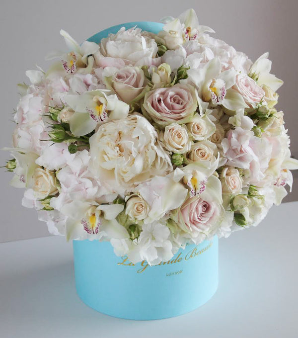''Glamour'', freshflowerbox, La Grande Beaute, Fresh, Romance is the glamour which turns the dust of everyday life into a golden haze. Filled with white peonies, hydrangeas, classic and spray roses and orchids this arrangement simply takes the breath away. The arrangement in the photo is in the blue 25cm size La Grande Beaute velvet box. Central London Delivery Only. Please check our shipping policies for postcodes. DISCLAIMER - FRESH FLOWERS: These are fresh cut flowers and are perishable.Pleas