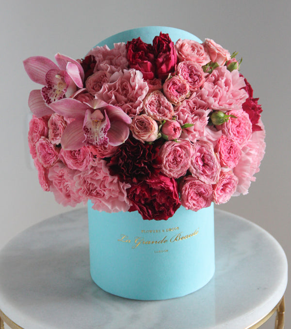 ''Miss Pink'', freshflowerbox, La Grande Beaute, Fresh, petite, valentines, Make someone's day magical with the fresh flower box "Miss Pink". Filled with pink color spray roses, carnations and orchids, this arrangement simply takes the breath away. The arrangement in the photo is in a 15cm size La Grande Beaute velvet box. Central London Delivery Only. Please check our shipping policies for postcodes. DISCLAIMER - FRESH FLOWERS: These are fresh cut flowers and are perishable.Please check "Care &