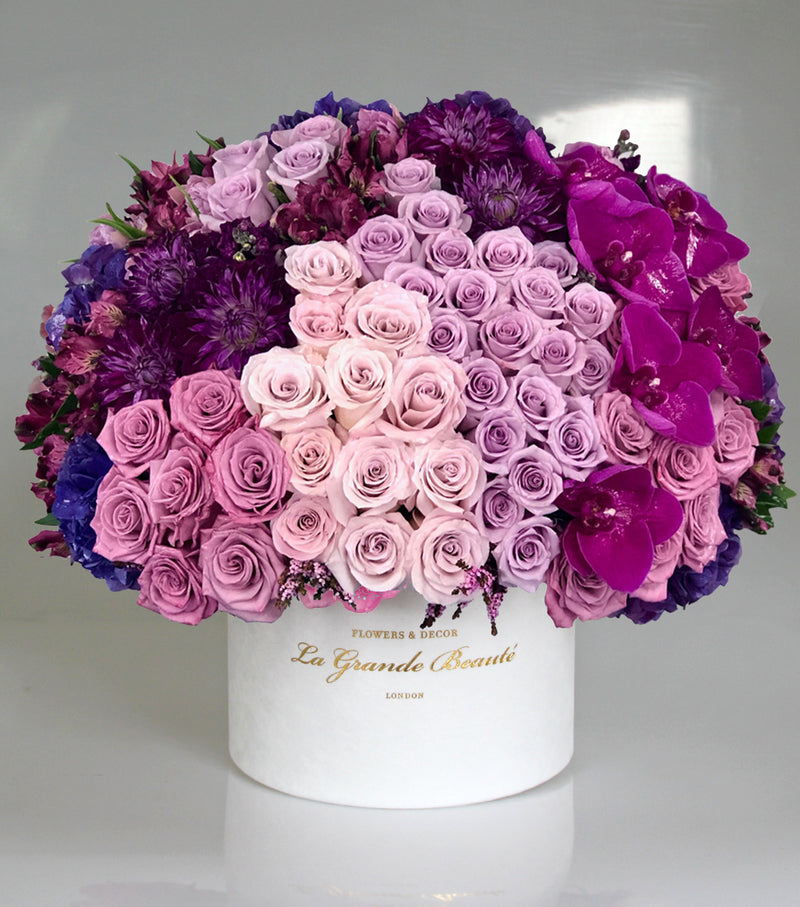 Indulgent mix of roses, dahlias, fuchsia orchids, hydrangeas and more. placed in a Large white velvet La grande Beaute box. Perfect as a present all year round 