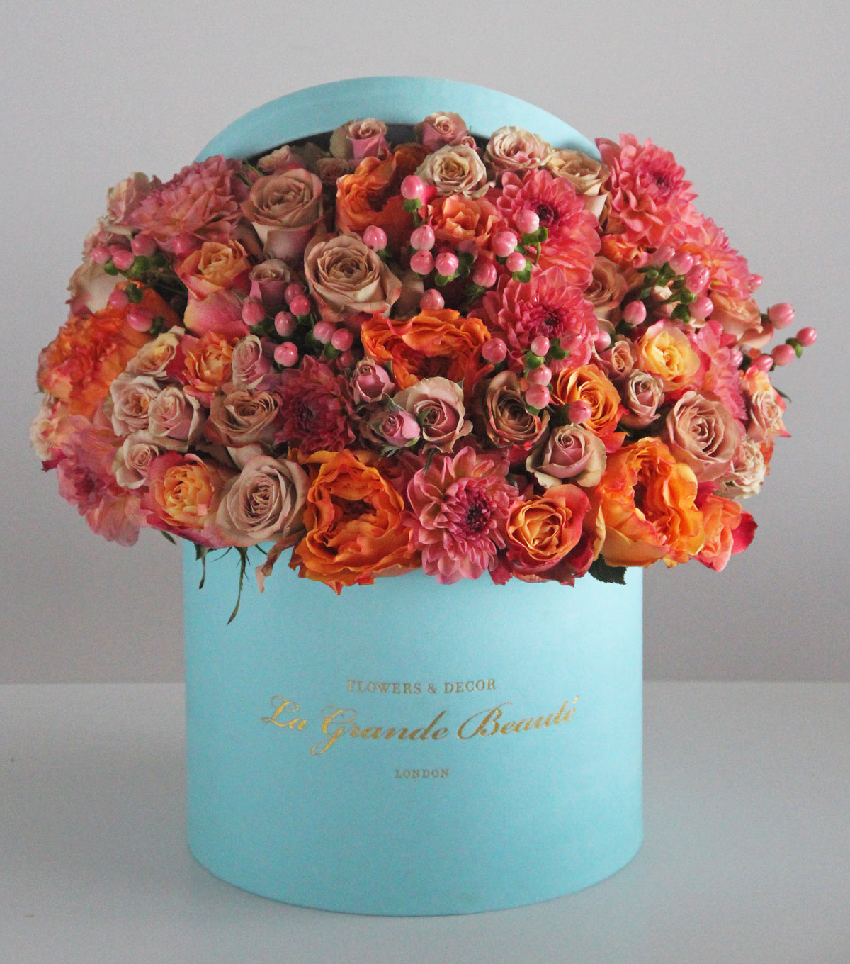 “Peachy” – orange rose and carnation velvet box by La Grande Beauté, luxury flower delivery London